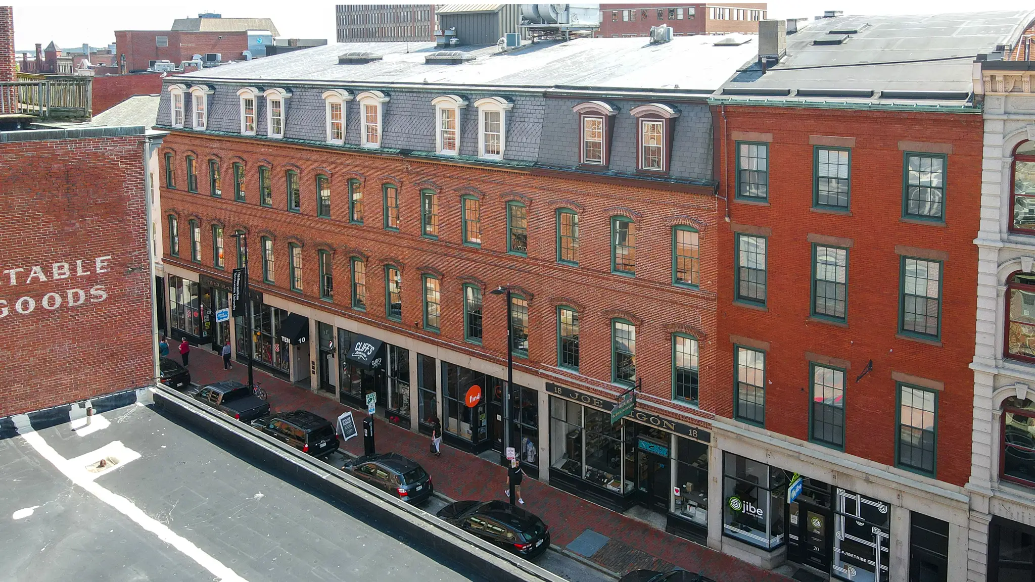 View of the J.B. Brown & Sons 10-16 Free Street classic brick building in Portland, Maine from the rooftop across the street